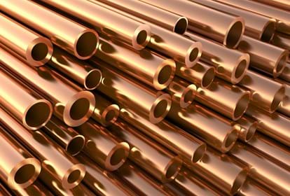 Close up of a stack of copper pipes