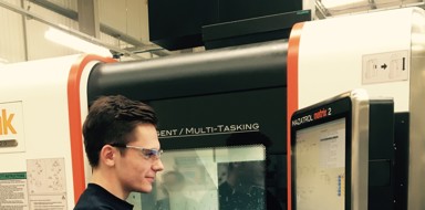 Young engineer operating a machine at Beverston Engineering