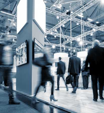 People moving around a manufacturing industry trade fair