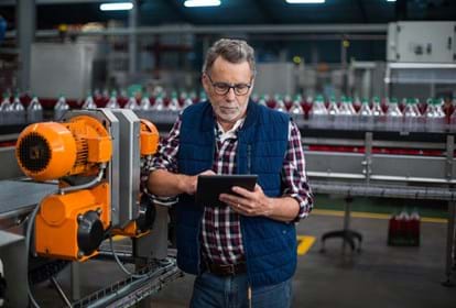 Man using tablet inside a factory