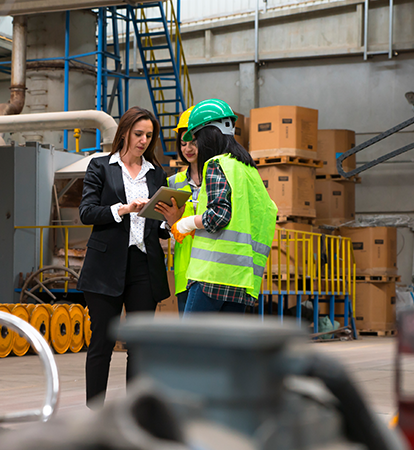 Female supervisor in a factory holding a tablet