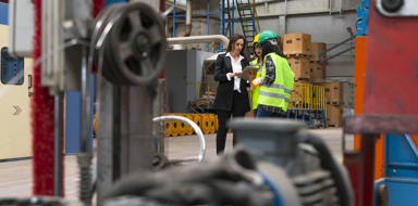 Female supervisor in the factory holding the tablet