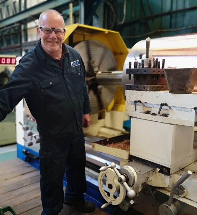 Engineer working on an industrial machine from BEP Surface Technologies