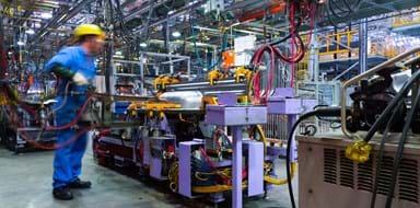 Modern automatic automobile manufacturing workshop. A busy car production line.