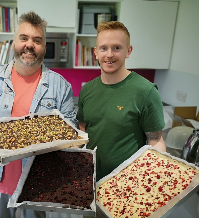 Senior leaders holding produce at Bells of Lazonby