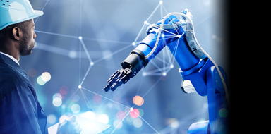 Male factory worker looking at a robotic arm with a conceptual futuristic background