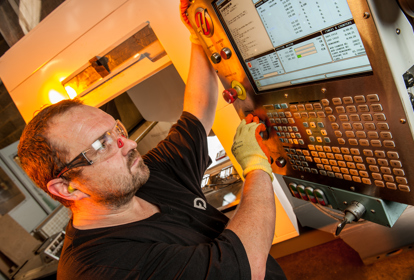 Engineer setting up a machine for production at Fabricon