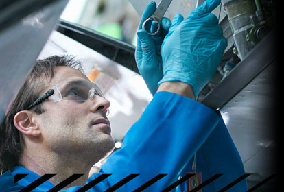 A specialist engineer inspecting a machine