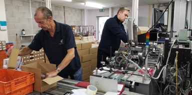 Plastic Card Services employees working inside the factory