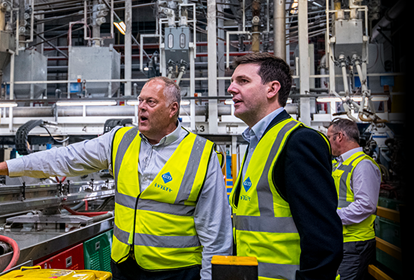 Two manufacturers observe factory operations onsite as part of a cohort on the Made Smarter Leadership programme.