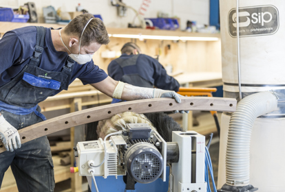Engineer working to shape a product at Handrail Creations