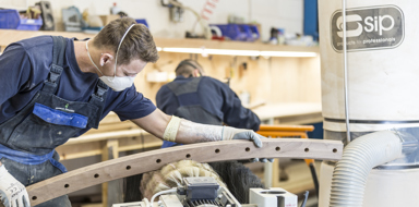 Engineer working to shape a product at Handrail Creations